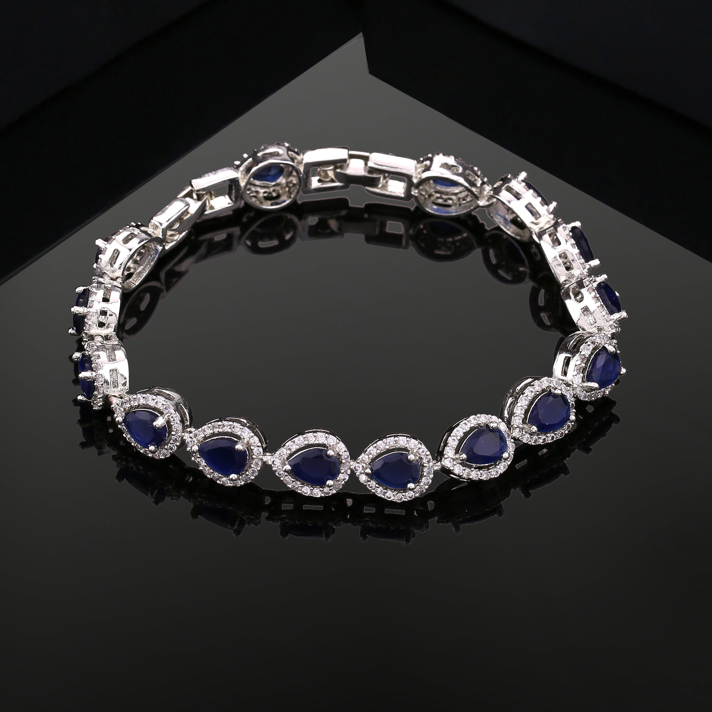 Estele Rhodium Plated CZ Drop Designer Bracelet with Blue Stones for Women