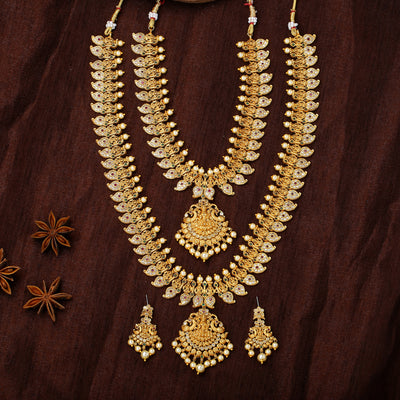 Estele Gold Plated CZ Laxmi Ji with Paisley Motifs Bridal Necklace Set Combo with color stones & Pearls