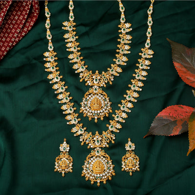 Estele Gold Plated CZ Divinity Laxmi Ji Designer Bridal Necklace set Combo with Green Stones for Women