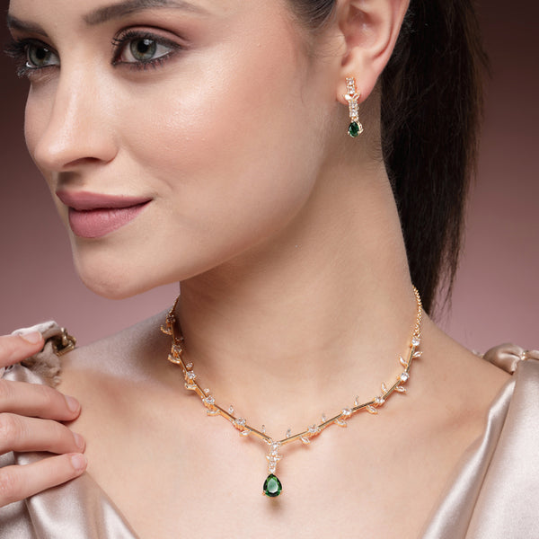 Regal Charm: Gold Plated Green American Diamond Teardrop Necklace Set – Designer Featherlight Jewelry for Reception & Celebrations