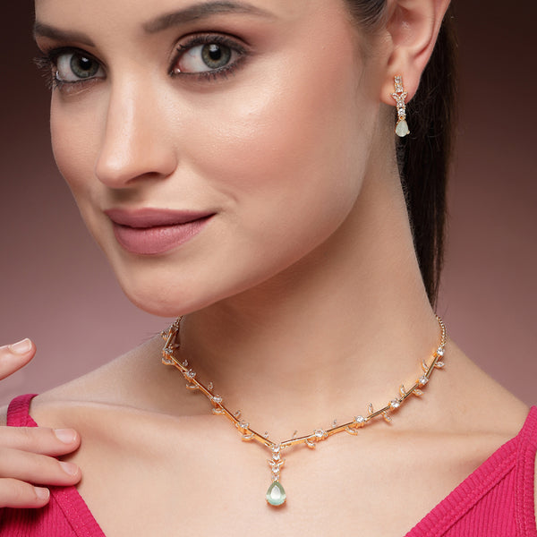 Graceful Bloom: Gold Plated Mint Green American Diamond Teardrop Necklace Set –Featherlight Designer Jewelry for Party & Festive Wear