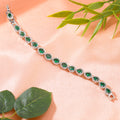 Estele Rhodium Plated CZ Classic Drop Designer Bracelet with Green Stones for Women