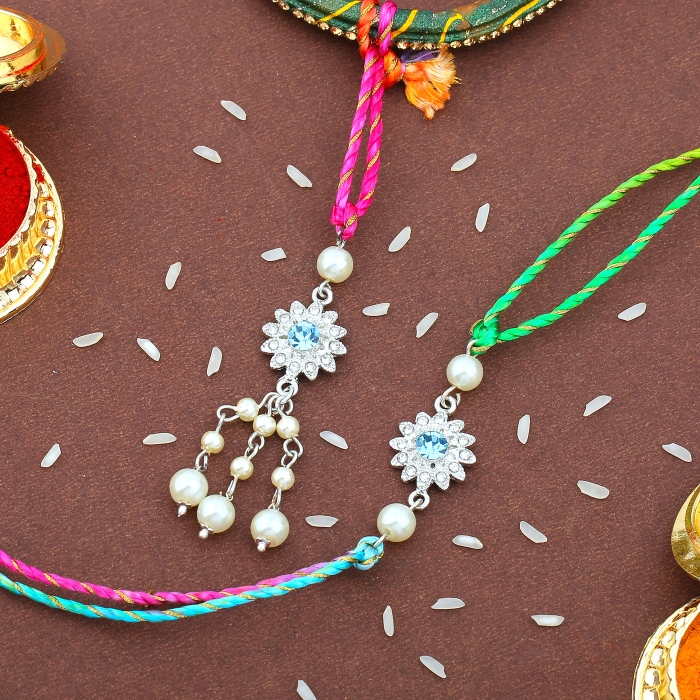Estele Rhodium Plated Ornamental Floral Rakhi set for Bhaiya Bhabhi With White Austrian Crystals and pearls with Multi Color Silk Thread