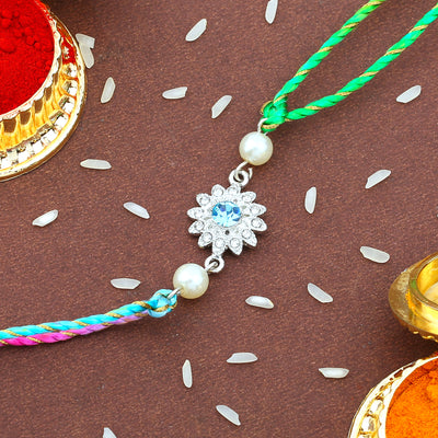 Estele Rhodium Plated Ornamental Floral Rakhi set for Bhaiya Bhabhi With White Austrian Crystals and pearls with Multi Color Silk Thread