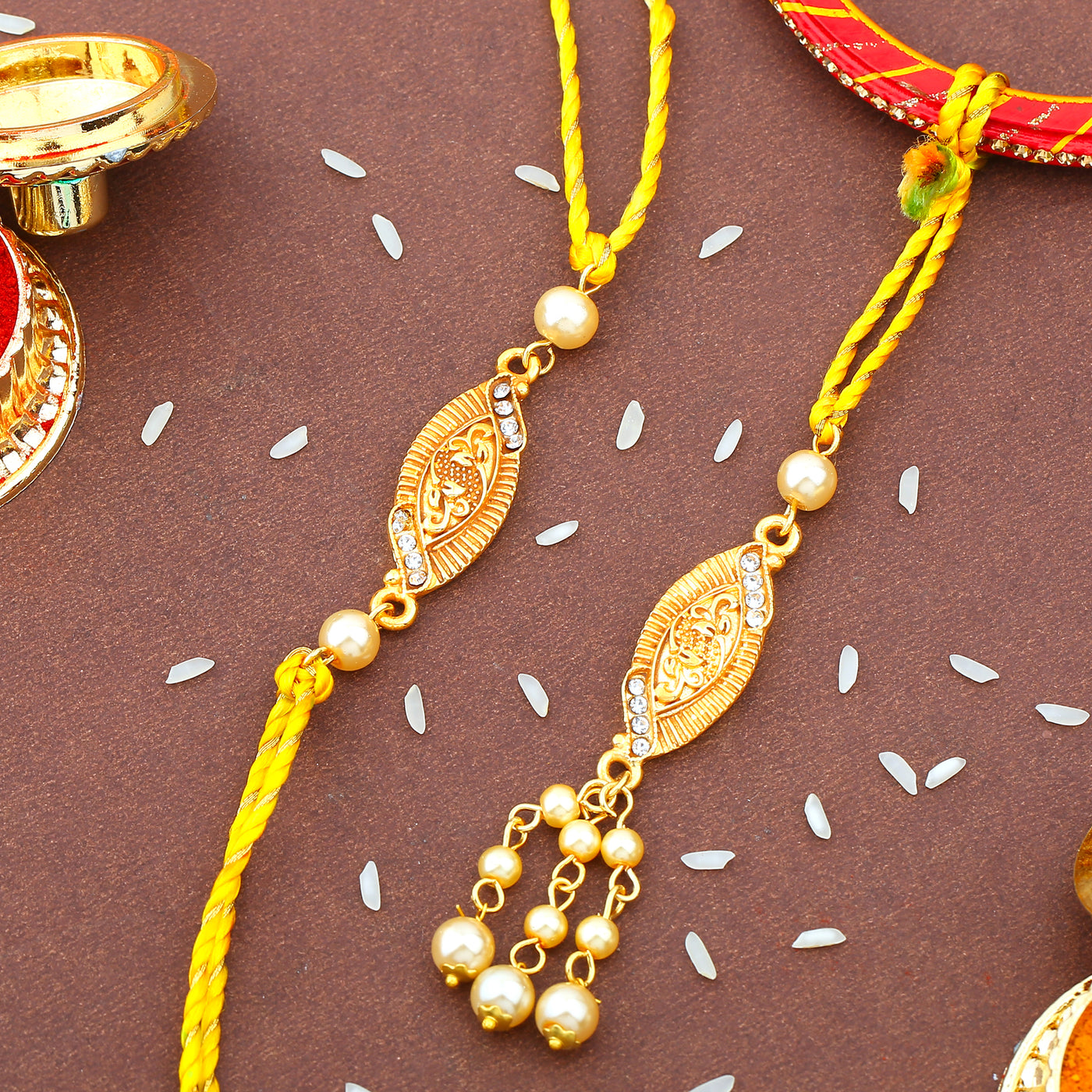 Estele Gold Plated Stylish Designer Rakhi Set for Bhaiya Bhabhi with Austrian Crystals & Pearls with Multi Color Silk Thread