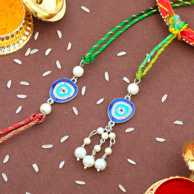 Estele Gold Plated Evil Eye Rakhi Set for Bhaiya Bhabhi with Navy Blue Enamel and White Austrian Crystals & Pearls with Fancy Silk Thread