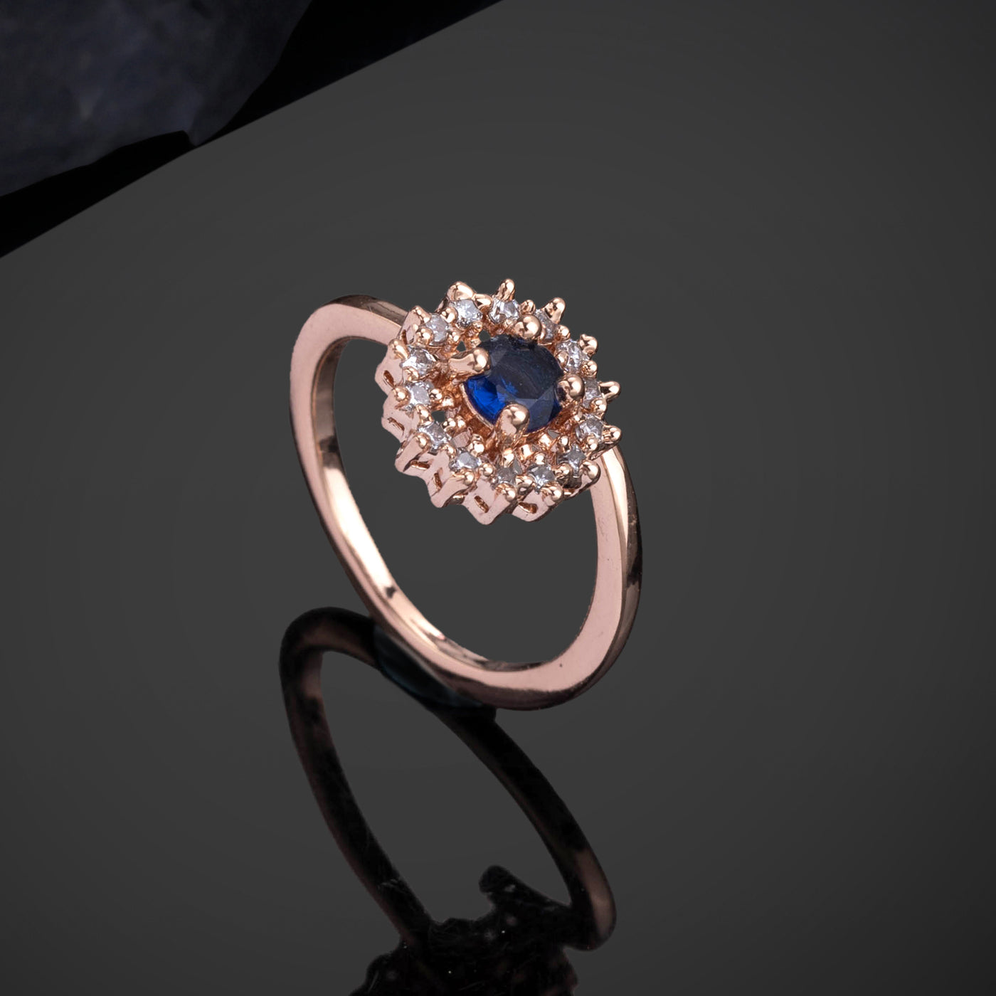 Estele Rose Gold Plated CZ Flower Designer Finger Ring with Blue Stones for Women (Adjustable)