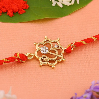 Estele Gold Plated Floral Om Rakhi with Austrian Crystals and Divine Red Silk Thread