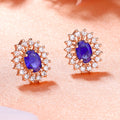Estele Rosegold Plated CZ Beautiful Oval Designer Stud Earrings with Blue Stones for Women