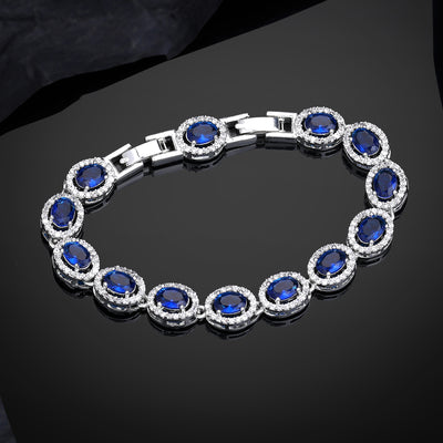 Estele Rhodium Plated Dazzling Blue American Diamonds Enhanced Charm Bracelet|A Touch of Glamour for Women