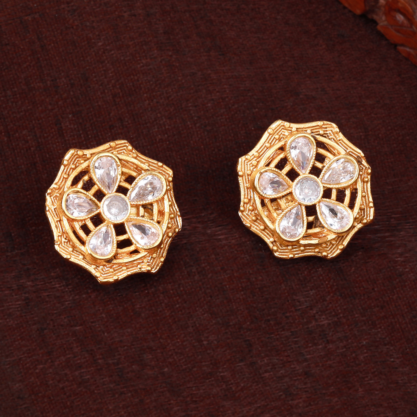 Estele Gold Plated Sparkling Flower Designer Matt Finish Stud Earrings with White Crystals for Women