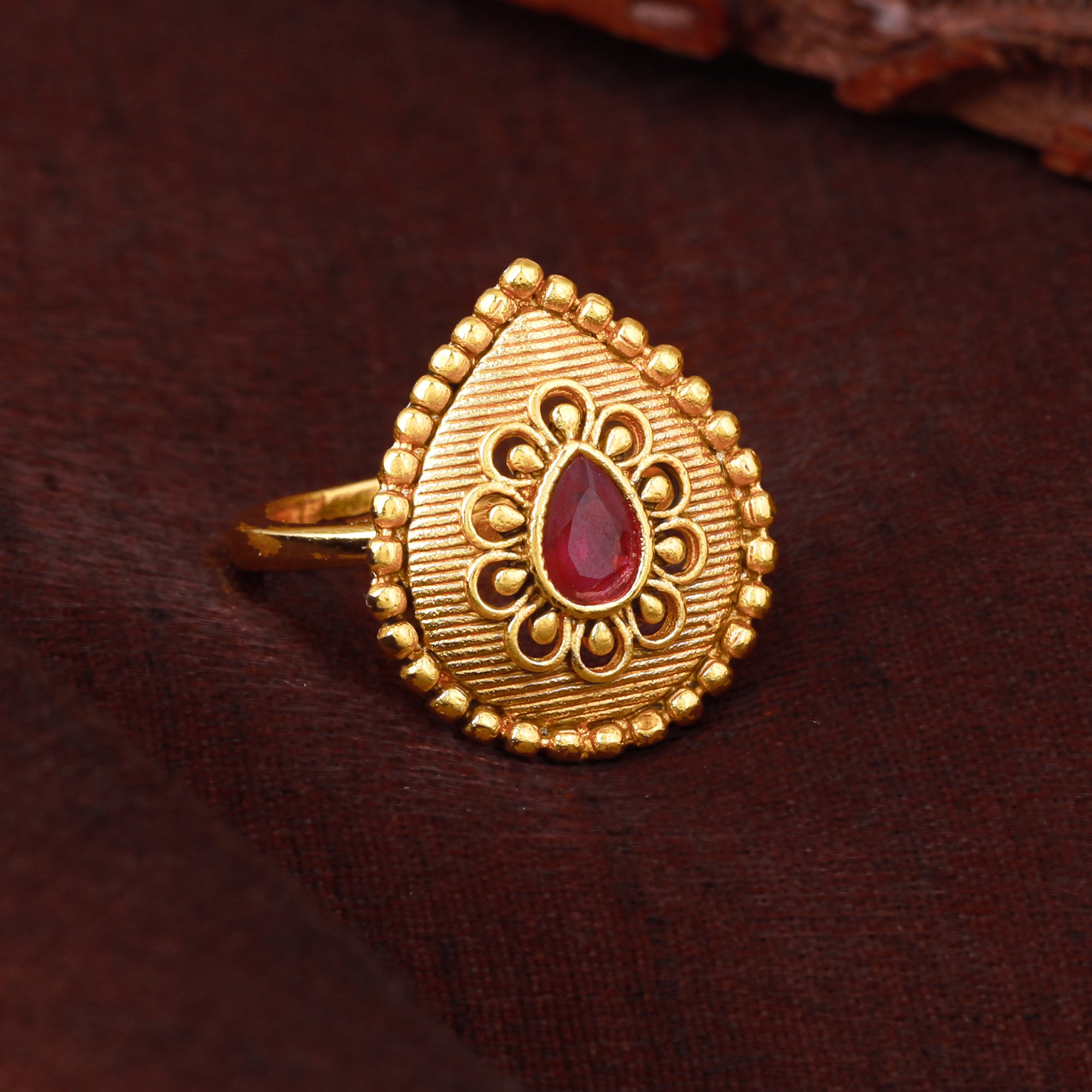 Estele Gold Plated Drop Designer Matte Finish Finger Ring with Ruby Cr