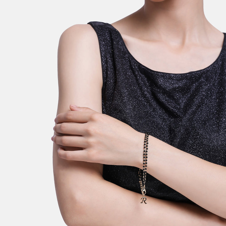 Estele Gold Plated Fascinating "R" Alphabet with Black Beads Bracelet for Women
