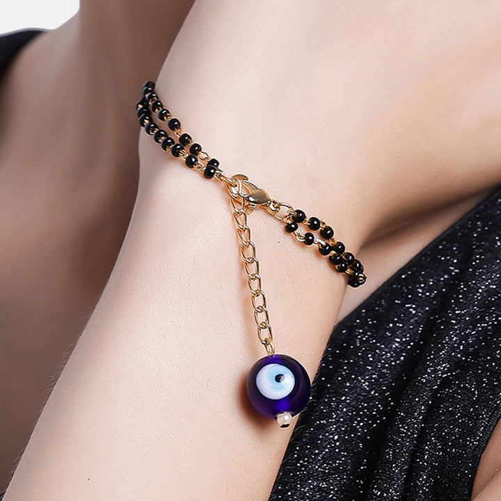 Estele Gold Plated Splendid Evil Eye Black Beads Bracelet for Women