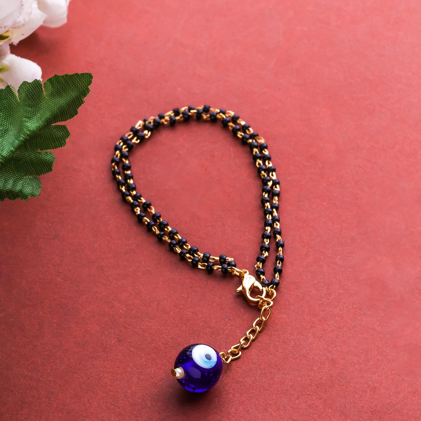 Estele Gold Plated Splendid Evil Eye Black Beads Bracelet for Women