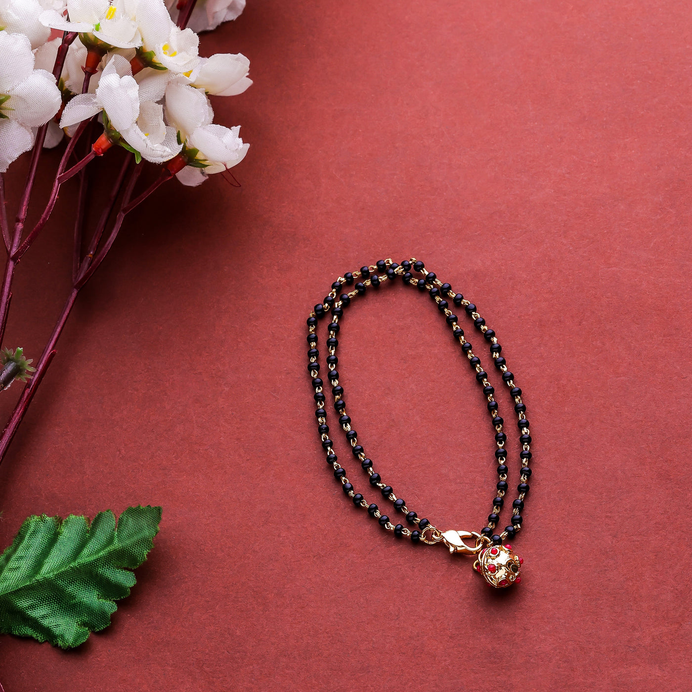Fida Luxurious Gold Plated American Diamond Stones & Black Beads Bracelet  For Women