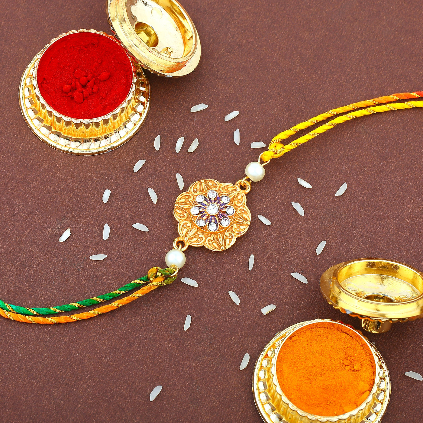 Estele Rakshabandhans Beautiful Gold Plated and White Austrian Crystals with pearls Bhaiya & Bhabhi Rakhi Set