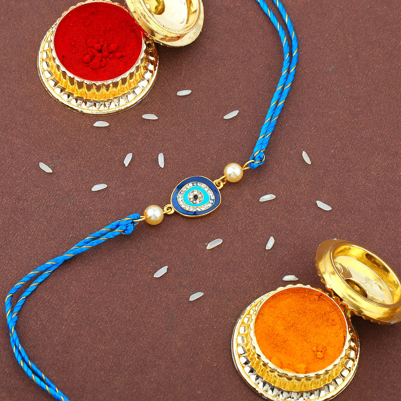 Estele Gold Plated Designer Evil Eye Rakhi Set for Bhaiya Bhabhi with Navy Blue Enamel and White Austrian Crystals with Fancy Silk Thread