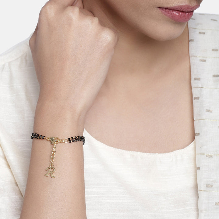 Estele Gold Plated Fascinating "R" Alphabet with Black Beads Bracelet for Women