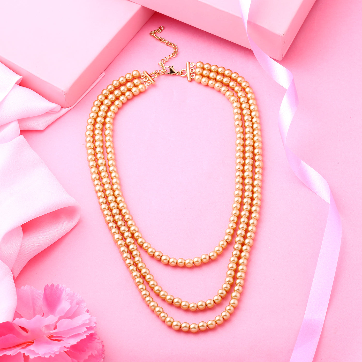 Estele gold pearl three layered necklace