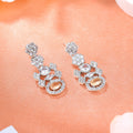 Estele Rhodium Plated CZ Flower Designer Earrings with Mint Orange Stones for Women